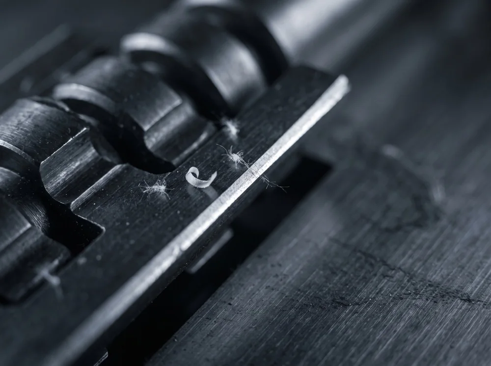 Macro of hardened steel shredder cutting components